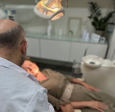 a man in a dentist's chair in a dental room