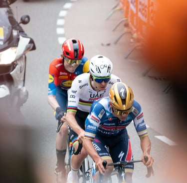 three pro cyclists riding in a race