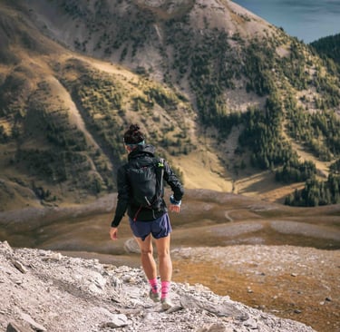 Girl trail runner in the moutain
