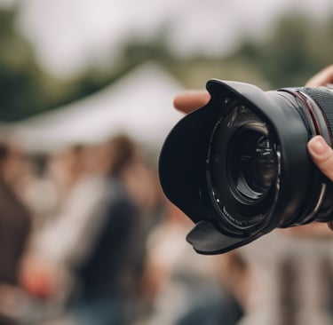 a man taking a picture of a camera