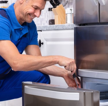 a man in a blue shirt and blue overalls and a blue shirt