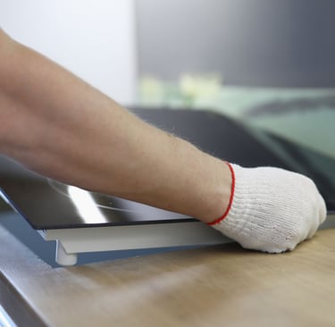 a person wearing gloves and gloves is cleaning a counter top