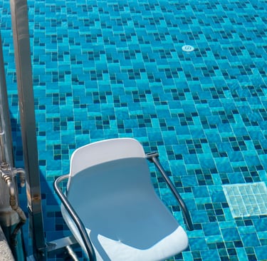 a chair that is sitting in front of a pool