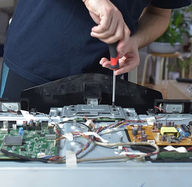 a man is holding a pair of scissors and a pair of scissors