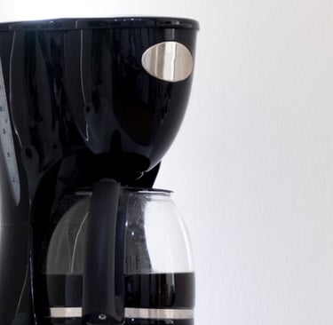 a coffee maker with a glass coffee maker