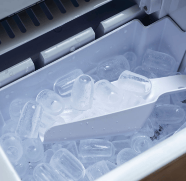 a plastic container filled with ice and a spoon