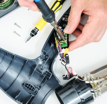 a person is holding a pair of scissors and a pair of scissors