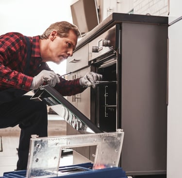 a man in a red shirt and a blue and white kitchen
