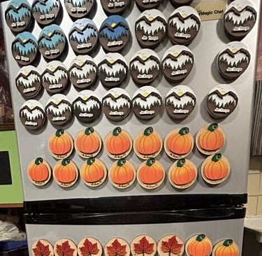 laser engraved and painted mountain and pumpkin souvenir magnets