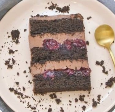 a piece of cake with chocolate frosting on a plate