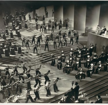 Overhead three‑quarter shot of Gold Diggers of 1935 “Lullaby of Broadway” with dancers in grouped fo