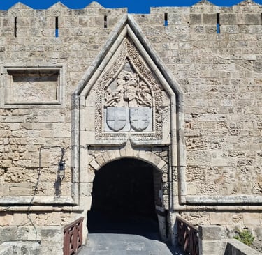 a stone wall with a stone archway and a stone wall