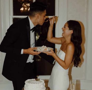Couple cutting their wedding cake together