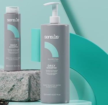 two bottles of hair care products on a table
