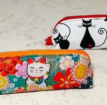 2 trousses à motif chat