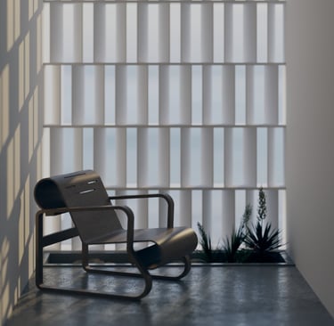 Sunlit reading nook with a sculptural black lounge chair and textured privacy screen