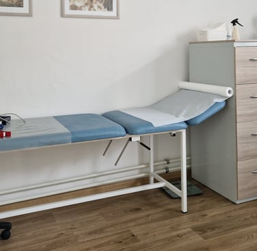 a hospital room with a bed and a desk