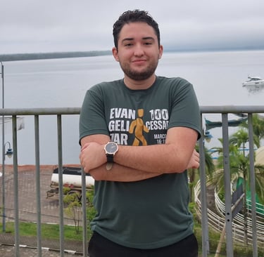 a man standing on a balcony with a view of the ocean andre oliveira fundador da anolive