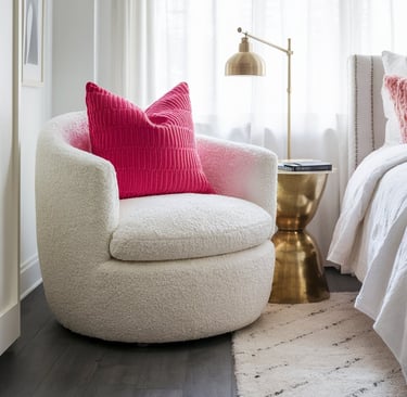 a chair with a pink pillow and a pink pillow