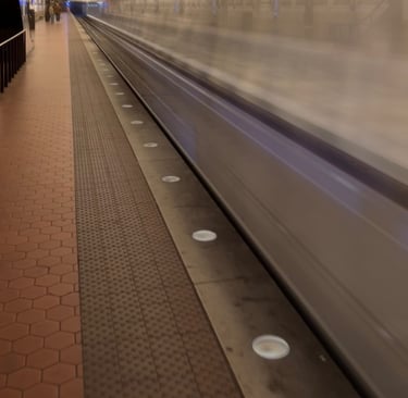 Washington metro subway station with a train leaving the station