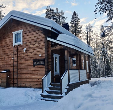 Rustic finnish log cabin in a snowy winter landscape, riekontupa cabin located in Kittilä lapland