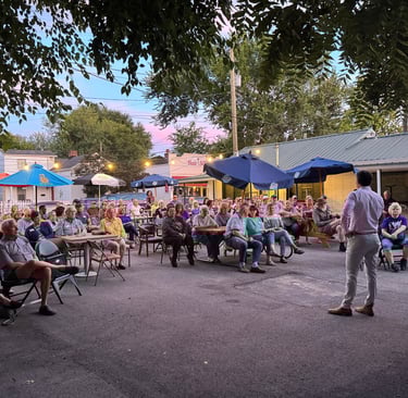 a man standing in front of a crowd of people