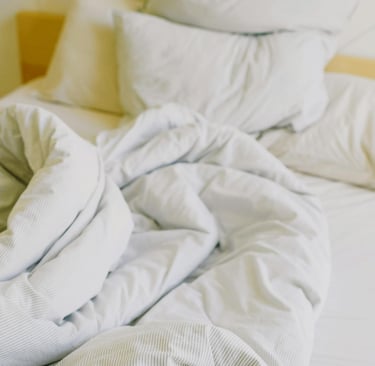 a messy unmade bed