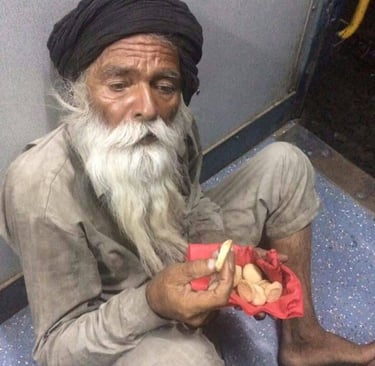 an old man with a white beard eating biscuits