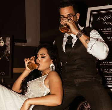 ride and groom holding champagne glasses for toast