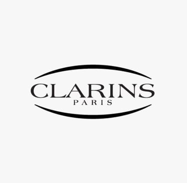 Logo of CLARINS, a global beauty brand whose standards are met by King Fly.