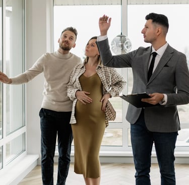 Real estate agent showing a home to potential buyers