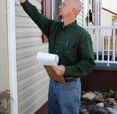 Home seller inspecting required home repairs