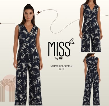 Woman wearing a navy blue sleeveless jumpsuit with white abstract print from the Miss 2026 collection.