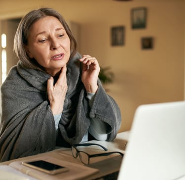 Woman waking up with neck stiffness due to bad pillow support