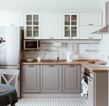 Functional organized kitchen layout with clear counters and simple storage design