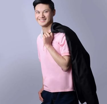 a man in a pink shirt and black jacket