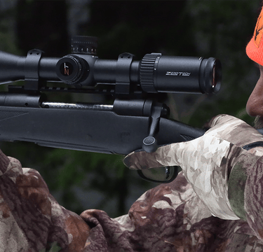 Image Link showing a hunter aiming Savage 30.06 with Zerotech Scope