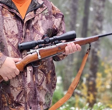 Image link of a hunter holding a Mauser rifle linking to a blog post about Mauser rifles