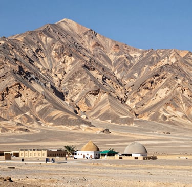 Close-up of hands holding prayer beads with the Masjid al-Haram softly blurred in the background.
