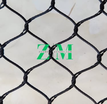 Durable black oxide stainless steel wire rope mesh for safety netting and architectural zoo enclosures.