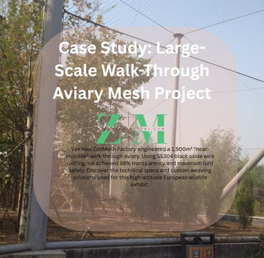 Aerial view of a large-scale walk-through aviary using black stainless steel cable mesh.