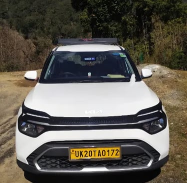 Kumaoni tour & travels Kia Crens Taxi