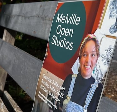 Promotional poster for Melville Open Studios 2025 featuring a local artist on a rustic wooden bench.