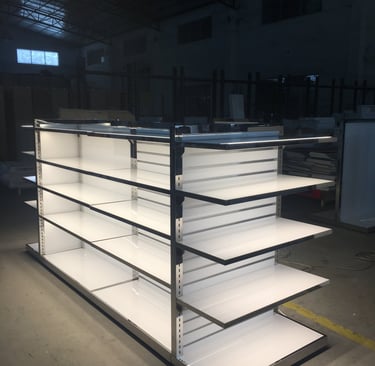 Double-sided white metal retail gondola shelving unit with integrated LED lighting for store displays.