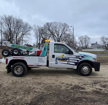 Side view of Ligfhtning Towing & Recovery truck ready for 24/7 service in Bourbonnais.