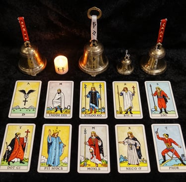 Bundles of dried witchcraft herbs and burning incense sticks releasing fragrant smoke in a shadowy room.