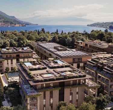 Luxury lakefront hotel with rooftop pools and gardens, overlooking Lake Garda with mountains
