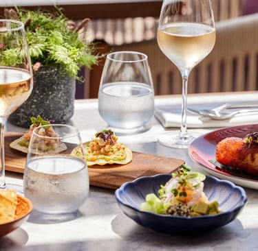 Gourmet appetizers and rose wine served on a sunny outdoor restaurant at Ikos Kissamos