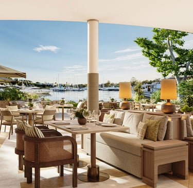 Luxury waterfront restaurant with elegant outdoor dining overlooking Sani  marina with yachts.