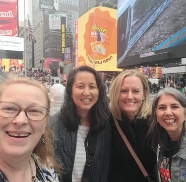 a group of people standing in front of a billboard